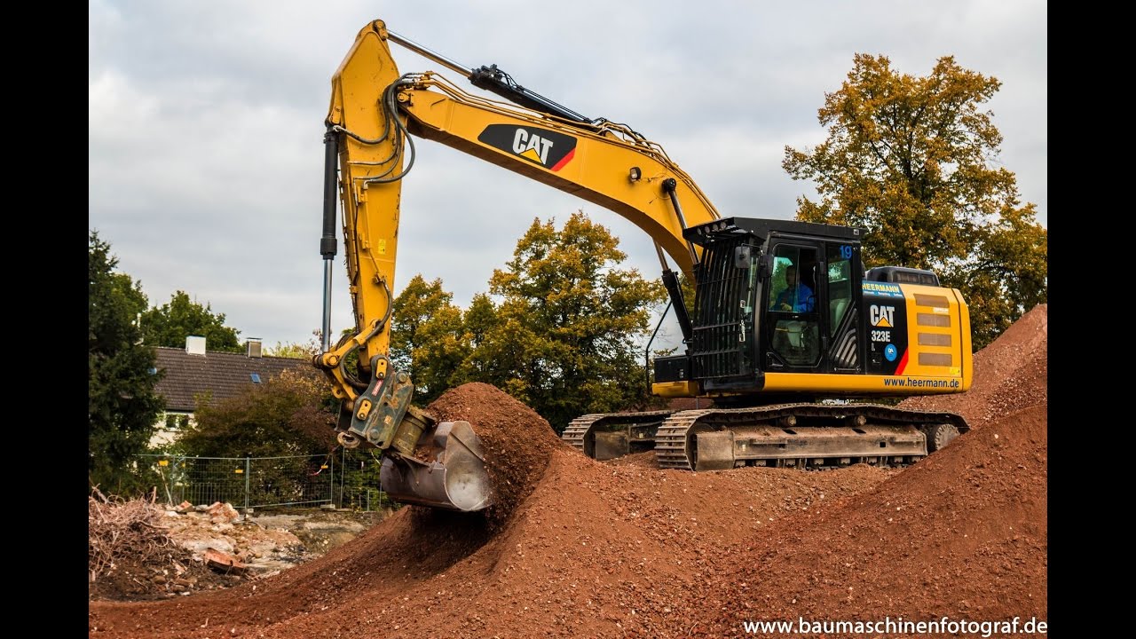 CAT 323 E mit OilQuick - Heermann Abbruch