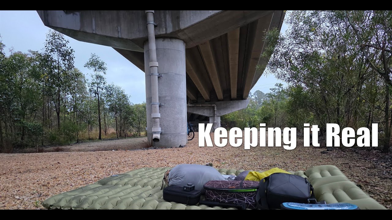 Keep it real by stealth camping under a bridge in the rain