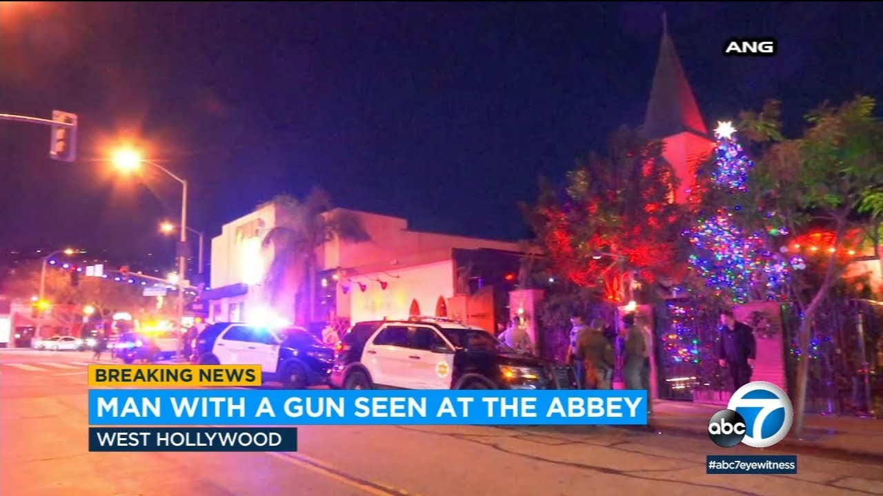 Man with a gun seen inside The Abbey in West Hollywood