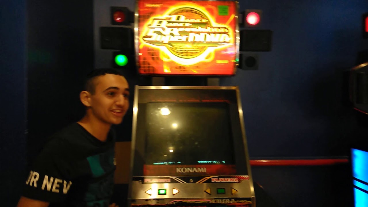 My Brother and his Friend playing Dance dance revolution in Time out de plaza norte
