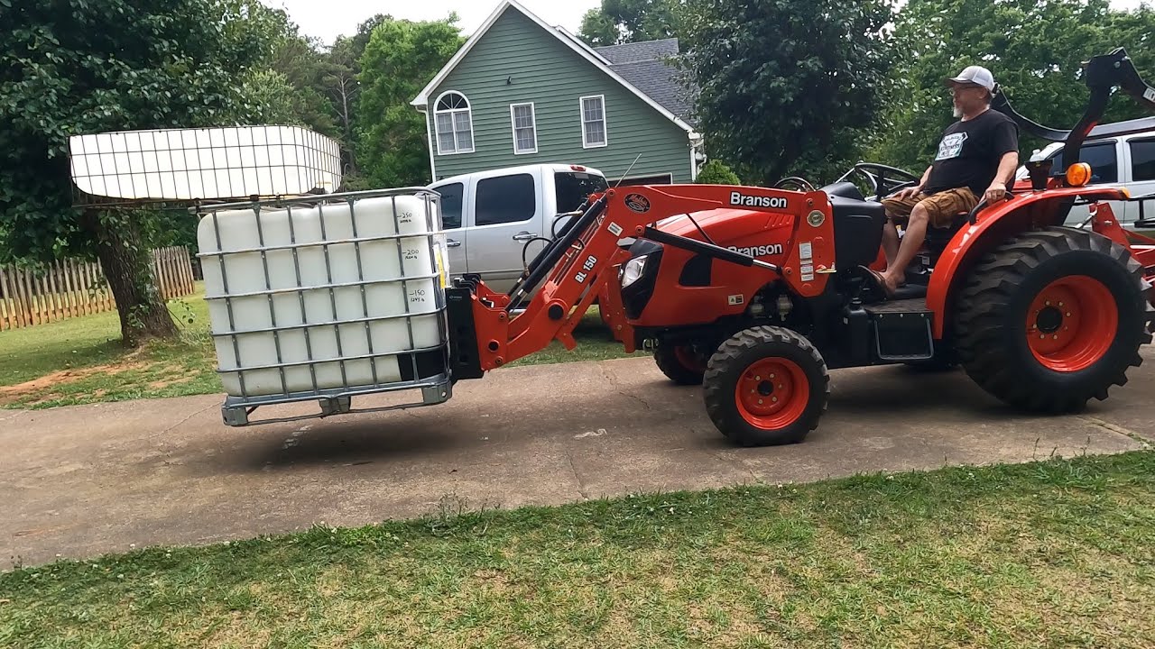 Testing The Lift Capacity Of A Branson 2515h Tractor Using Titan Pallet Forks & 200 Gallons Of Water