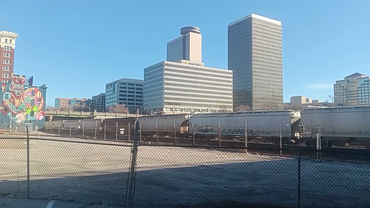 Union Pacific 5545 leading BNSF manifest under  bridge by jack stack barbecue in kansas city mo 