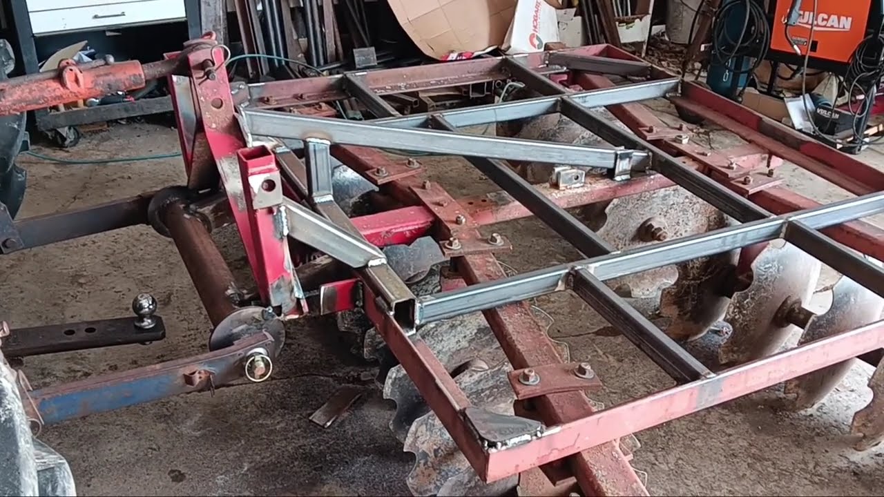 Disc harrow modifications in preparation for field work.