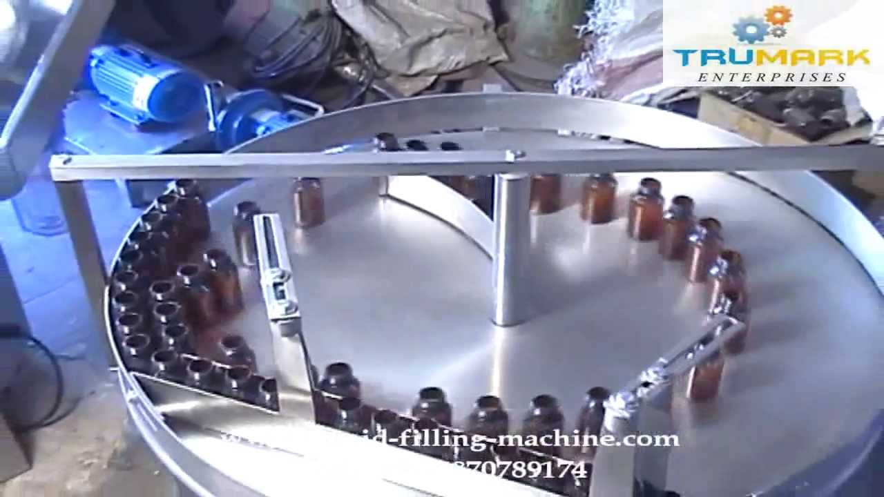 Automatic bottle filling capping machine manufacturer exporter, pharma liquid packaging line