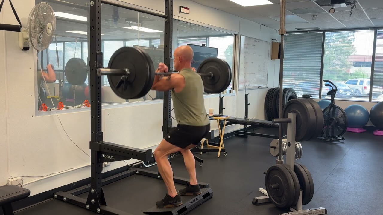 Stacking Weight Plates Is Easy. Squatting Them Is Legendary
