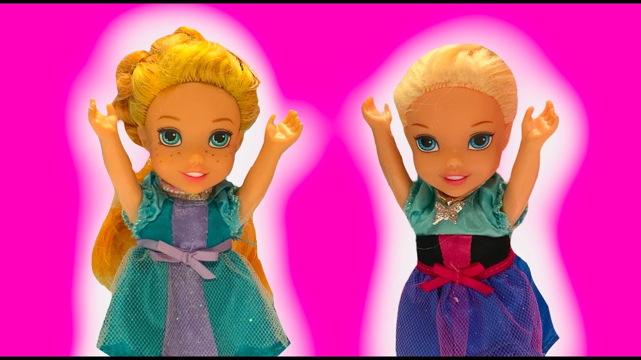 Elsa and Anna toddlers try new dresses