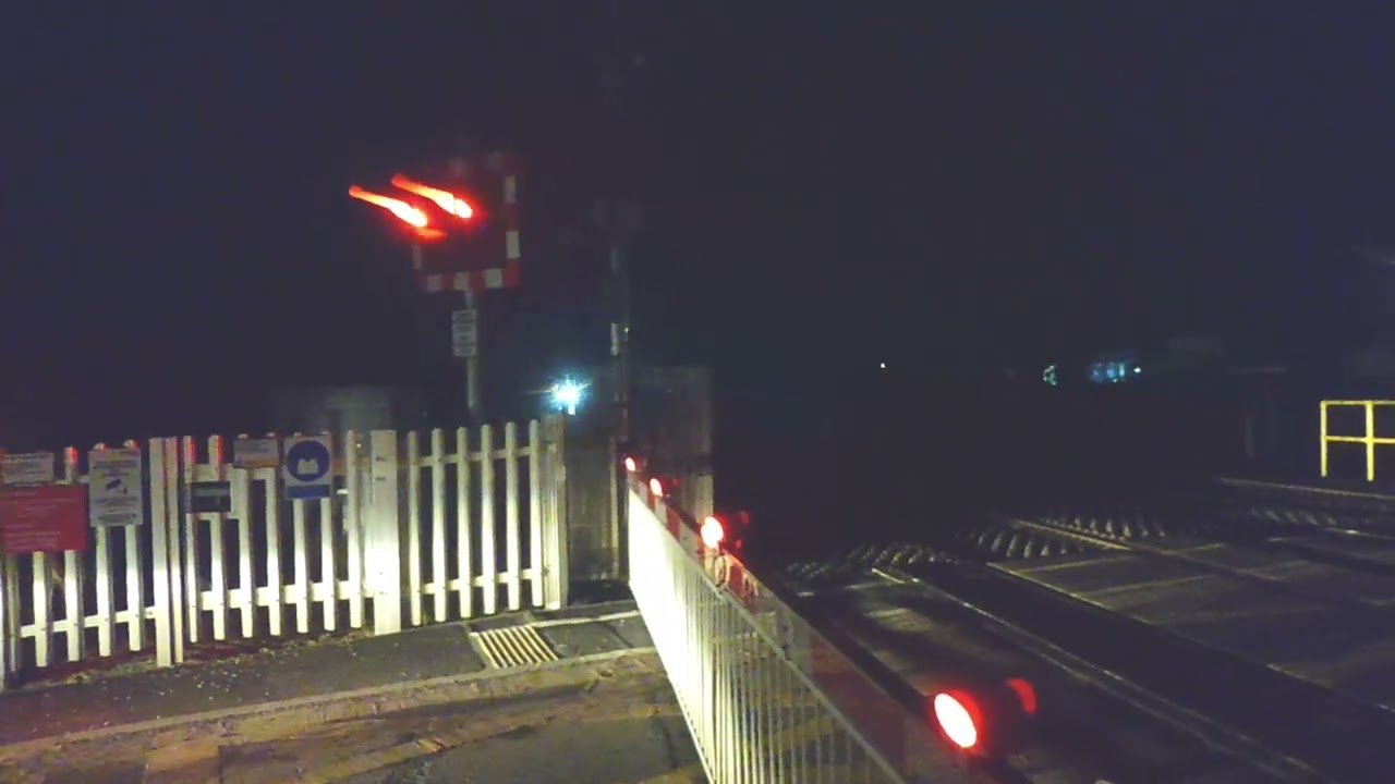 Unidentified freight train passes Bertwyn Level Crossing towards Carmarthen Sir Gar/Carms 24.2.26