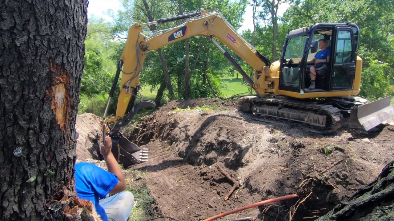 Replacing a Pond Overflow Pipe with Cat 308