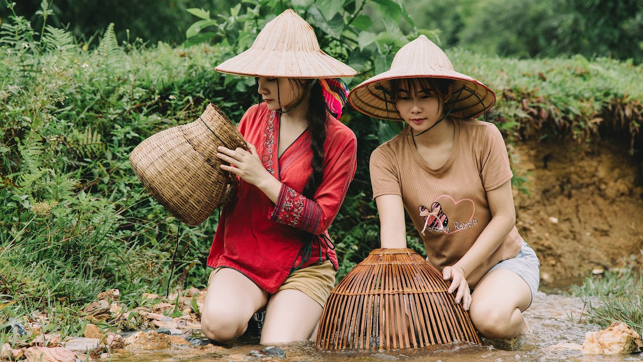 In harmony with nature: The simple life of two Vietnamese girls on a rainy day.
