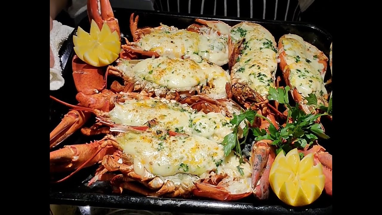 STEAMED AND BAKED LOBSTER WITH CHEESE SERVED WITH GARLIC HERBS BUTTER