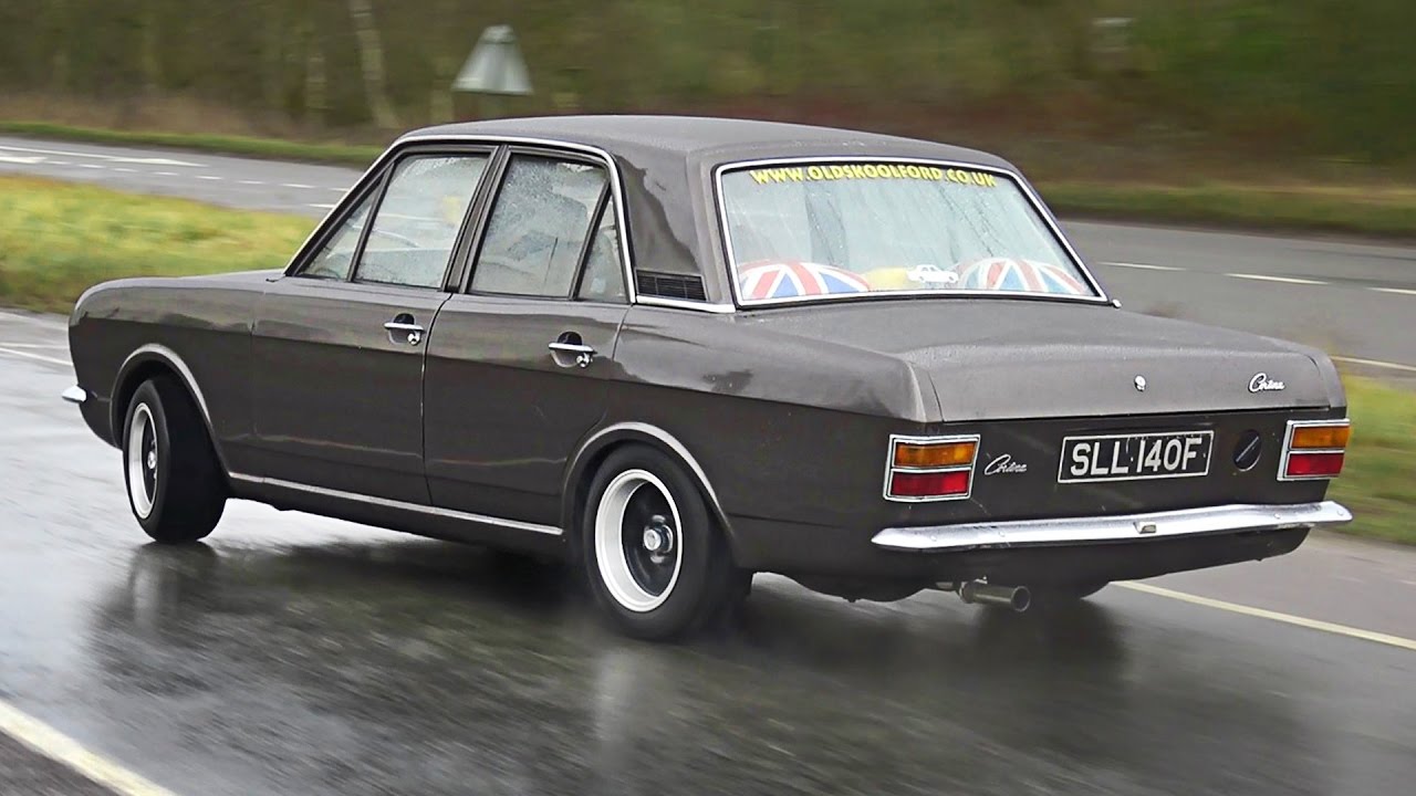Classic Cars leaving a Car Show in the Rain - January 2017