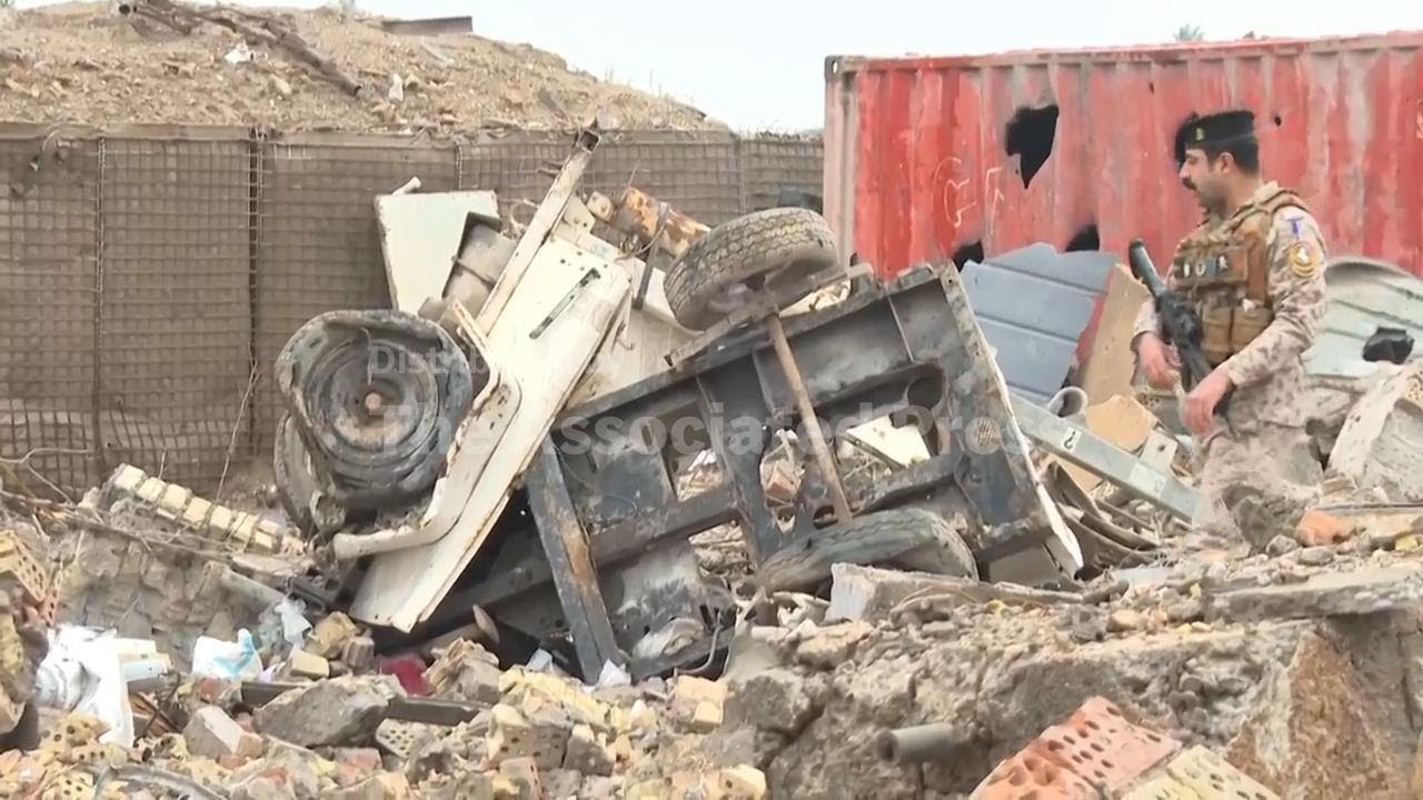 Aftermath of airstrike on military clinic in western Iraq that killed 7 soldiers