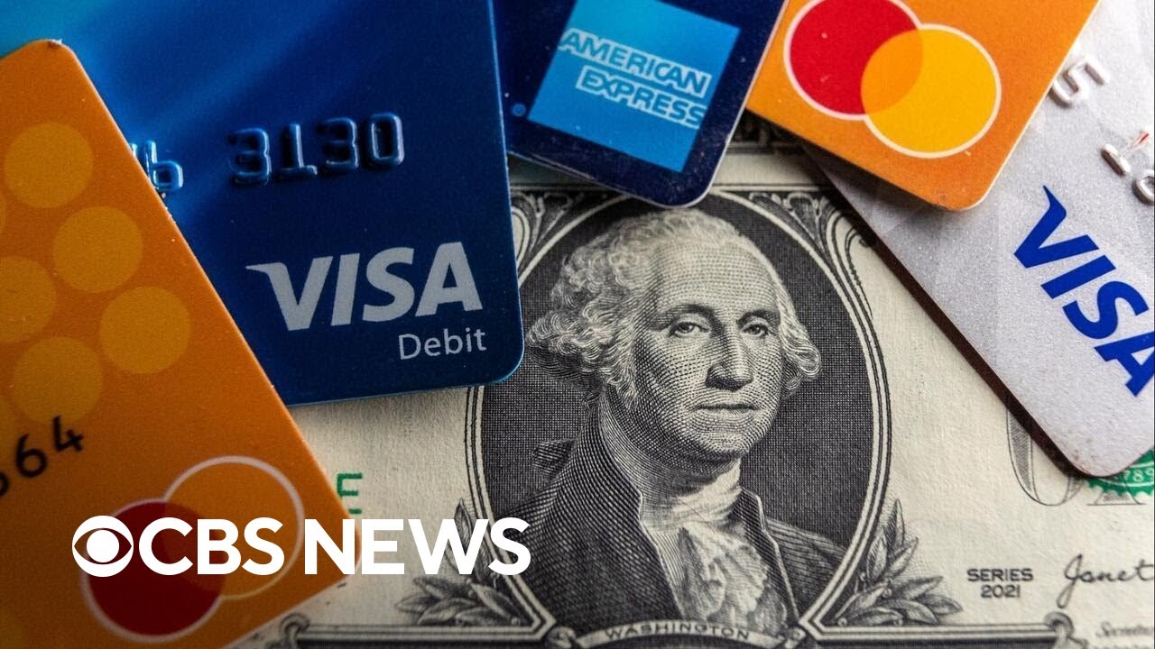 Record number of Americans carrying credit card debt they can't pay off, report shows