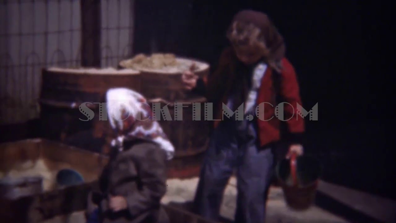 1948: Poor immigrant girl kids playing in industrial sandbox. ITHACA, NEW YORK