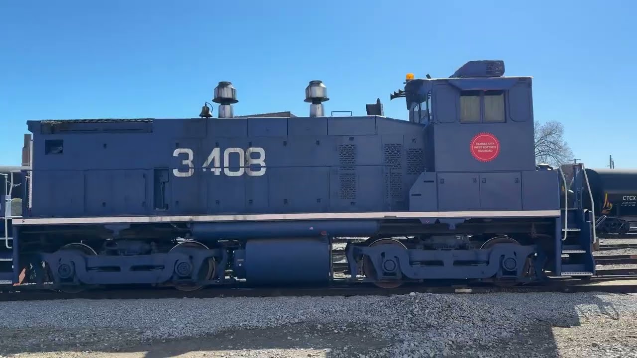 Kansas City West Bottoms Rail Road. sw1500. Plus a Union Pacific manifest train rolls thru.