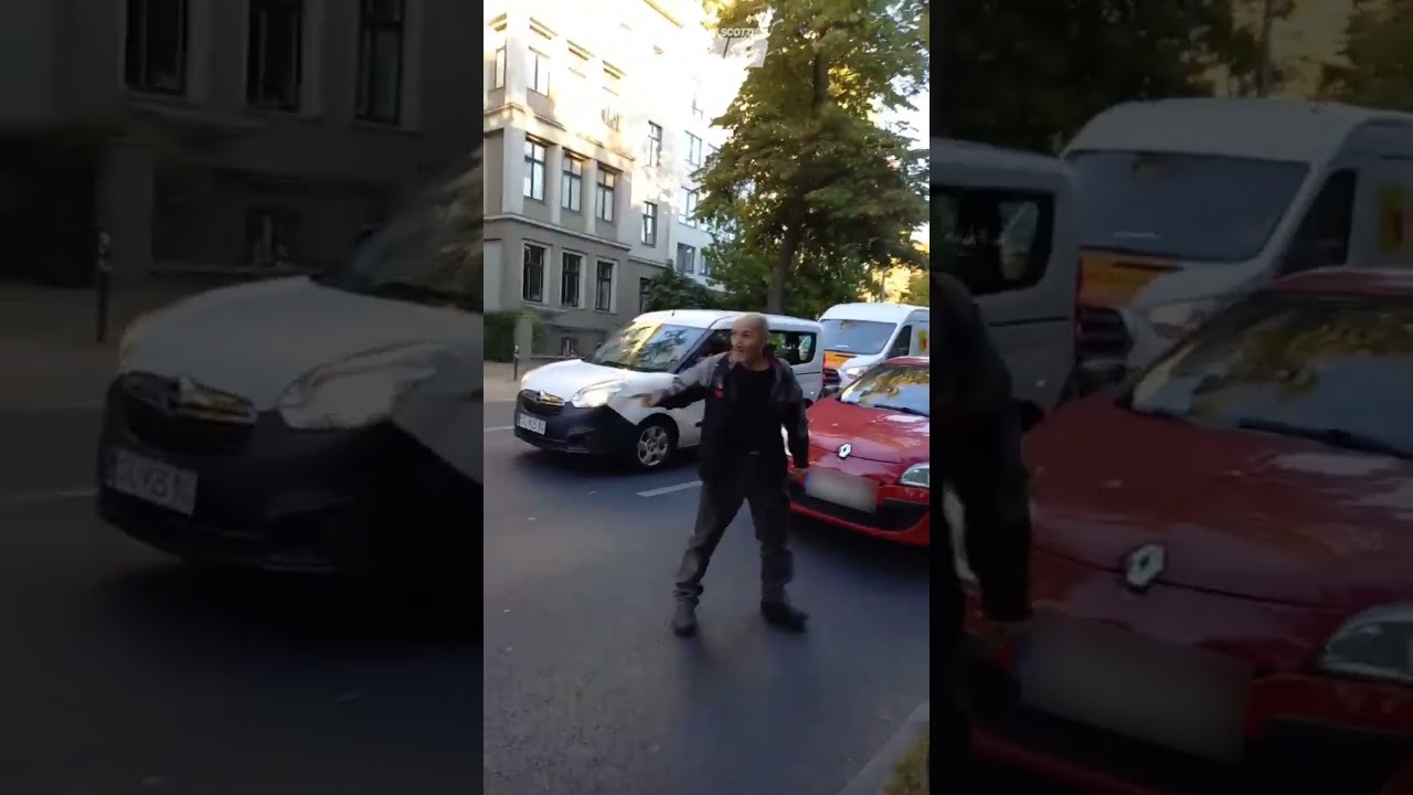 Motorist warns eco protesters then drives his car through their banner