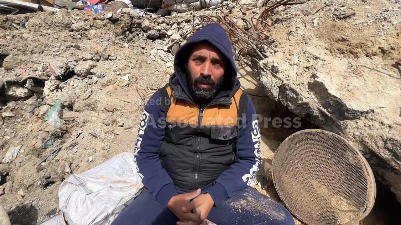 A father in Gaza searches for his family's bones in the rubble of their home