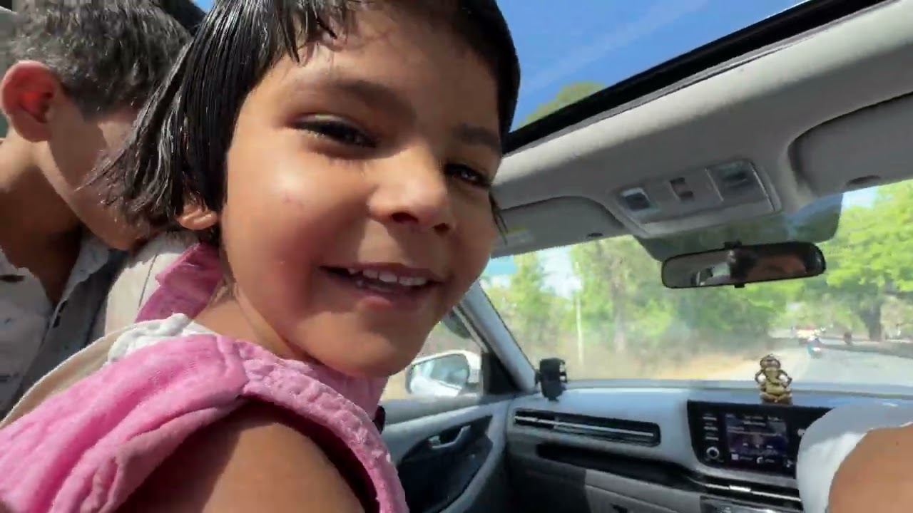 I’m driving a car with three kids. During the ride, I’m teaching them how to record videos