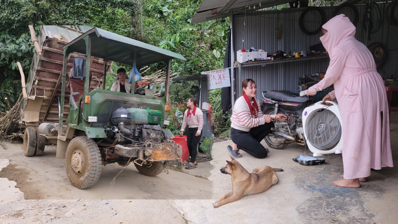 The girl repairs an old motorbike she bought from a scrap yard