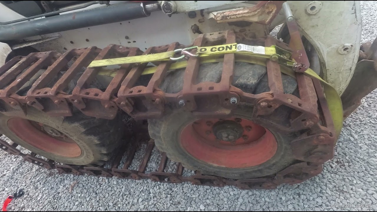 Grouser tracks install on a Bobcat skid steer