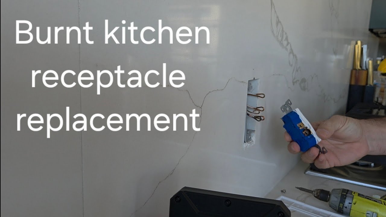 Burnt bulged receptacle at kitchen
