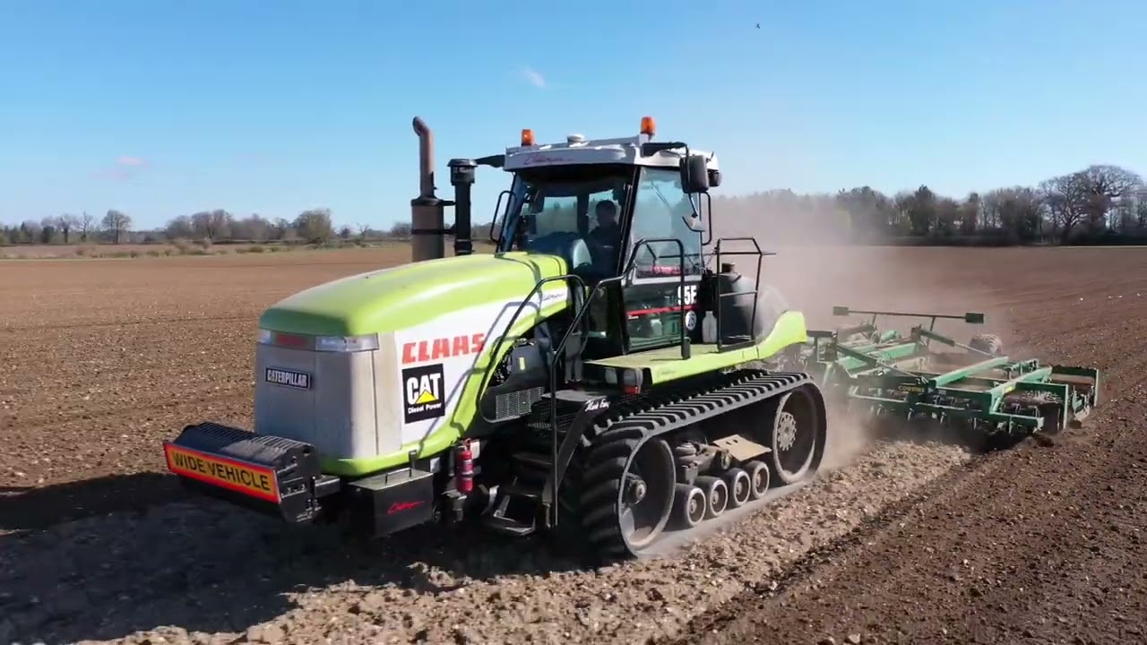 Challenger 95E with a Cousins seed bed harrow