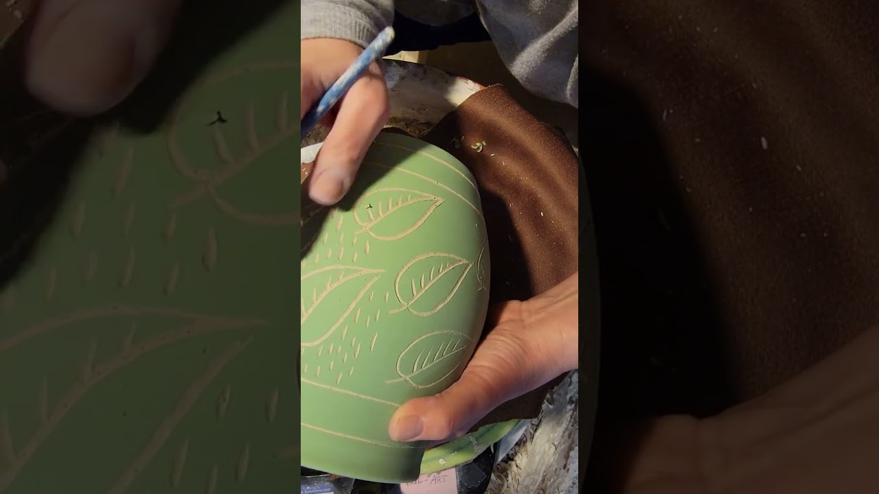 Relaxing- real time carving sgraffito into a stoneware jar