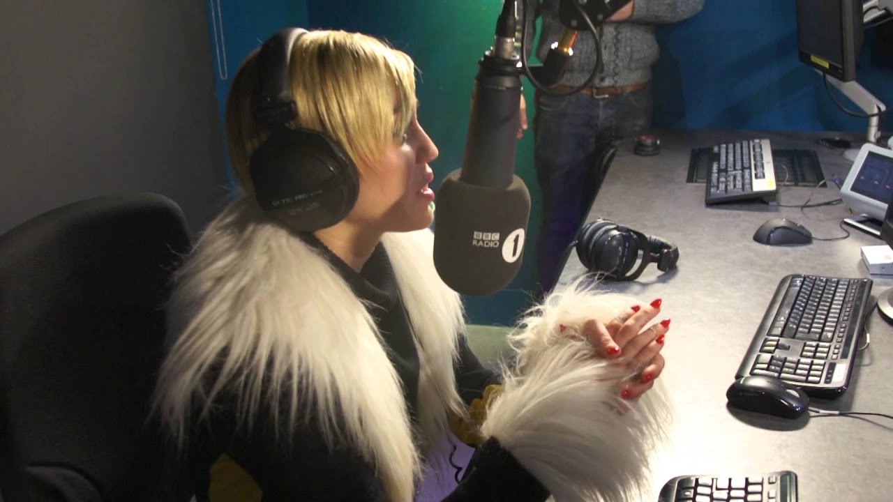 Greg James and ACTUAL Miley Cyrus on an ACTUAL Wrecking Ball
