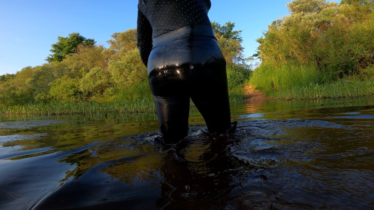 wet high leather boots, wet leather leggings and wet turtleneck in deep water