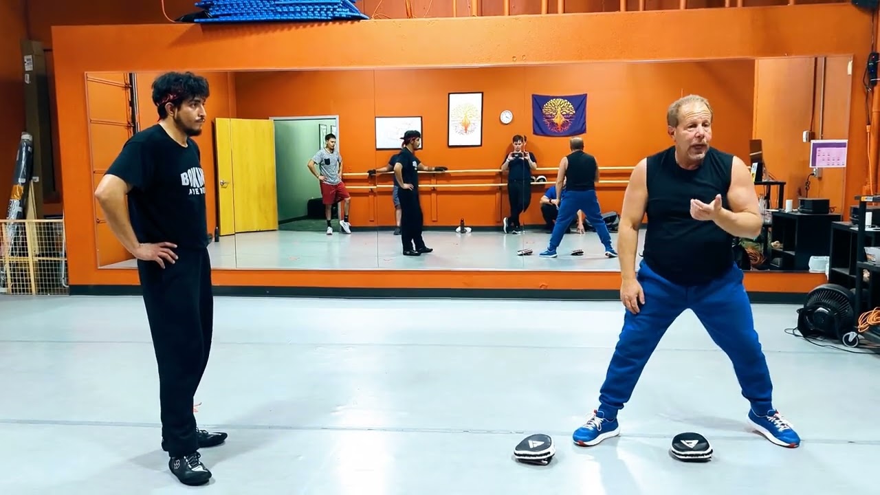 Arm punching to footwork drill