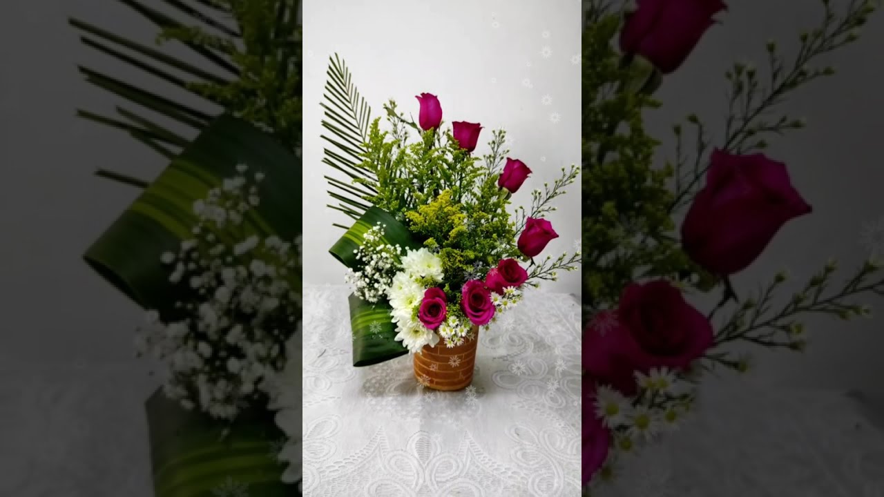 lets make an arrangement with roses and palms