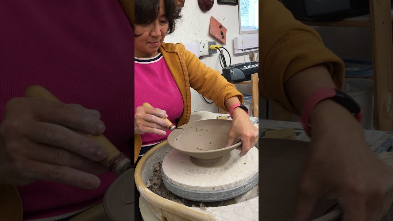 Trim inside pottery bowl to make even thickness