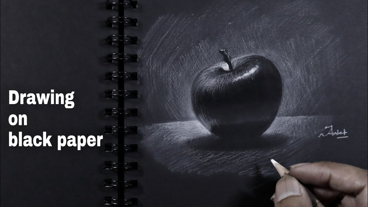 Drawing on black paper using white charcoal