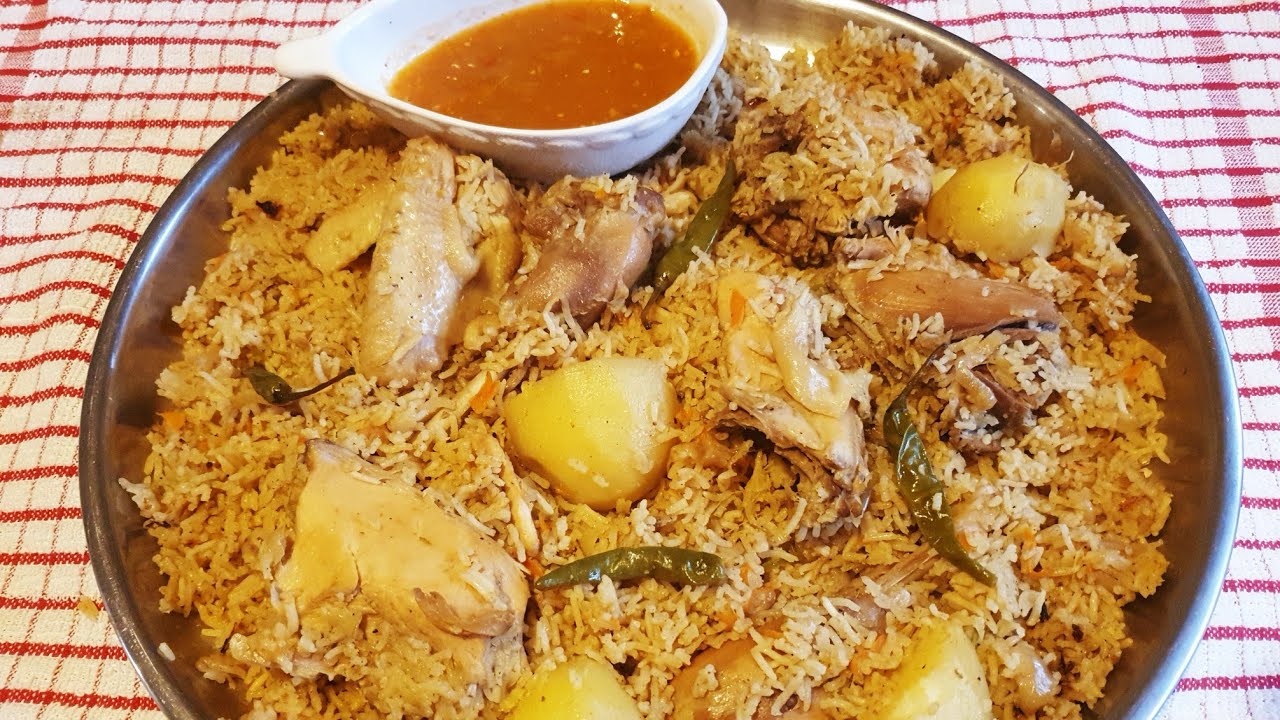 pilau ya nazi ya kuku  wa kienyeji tamu  sana  ajabu  linapikwa  hivi