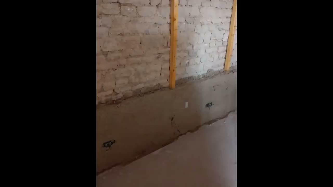 Casting lime hemp plaster on an internal wall.