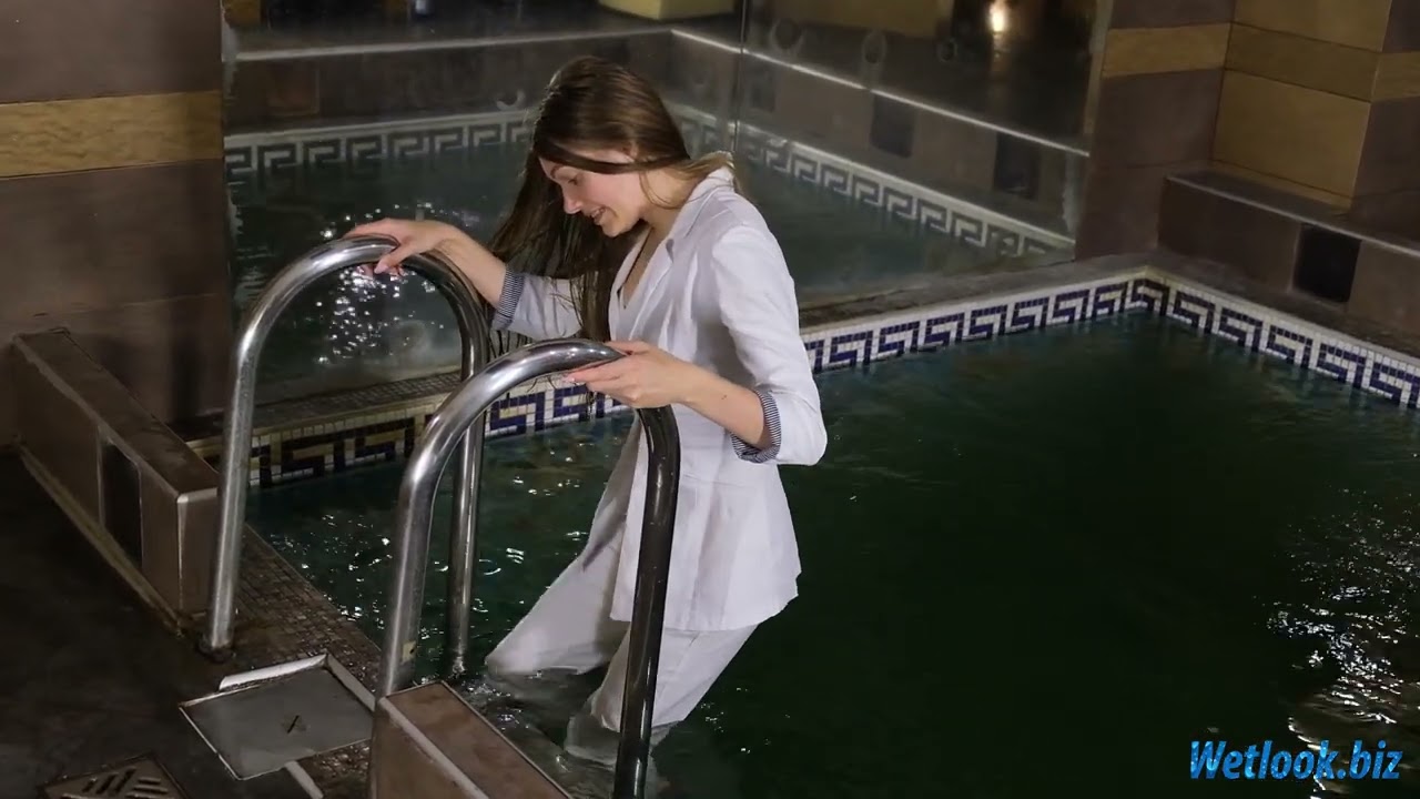 Wetlook White Outfit Enjoys a Relaxing Wetlook Pool Moment