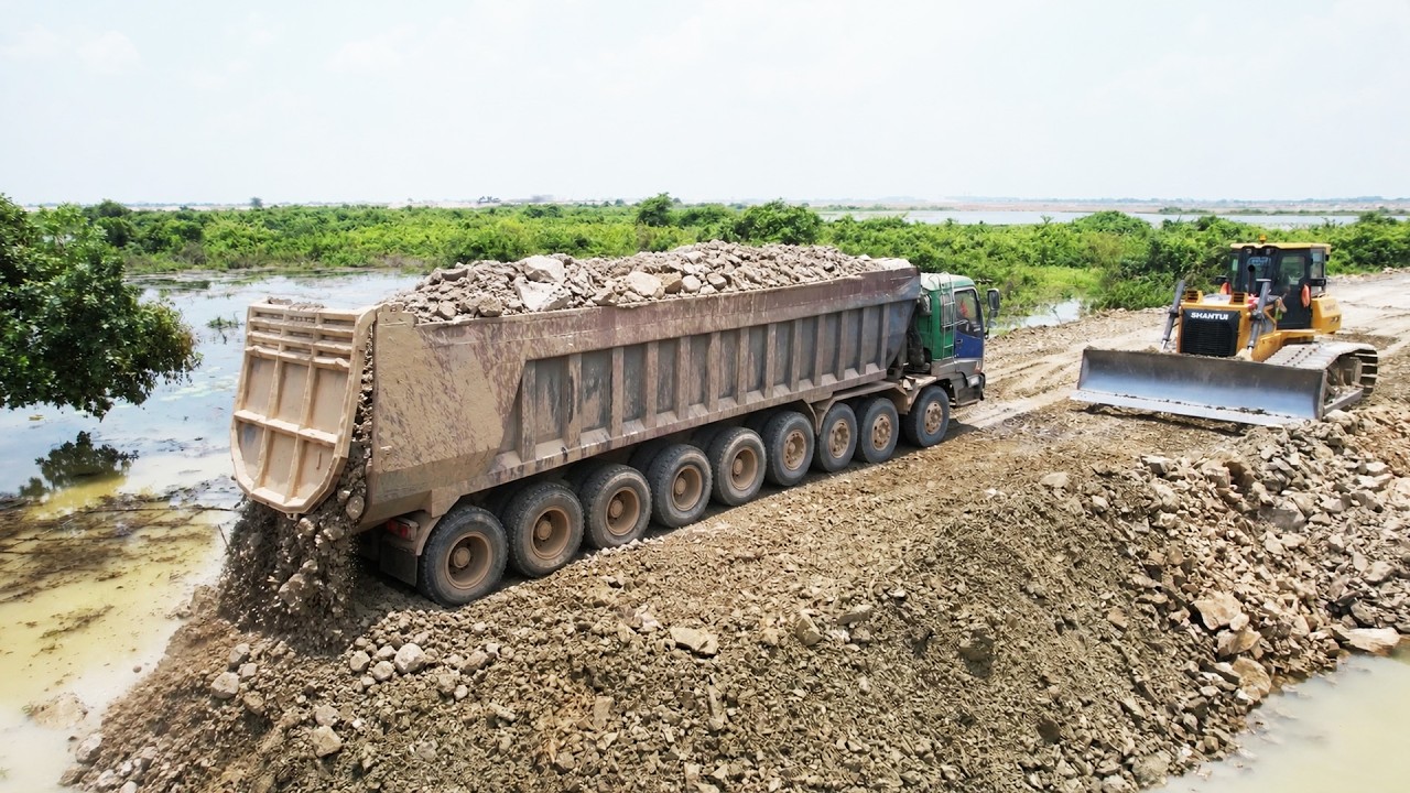 Incredible Skills Operator Bulldozer Working Pouring Stone To Building New Road in Deep Water