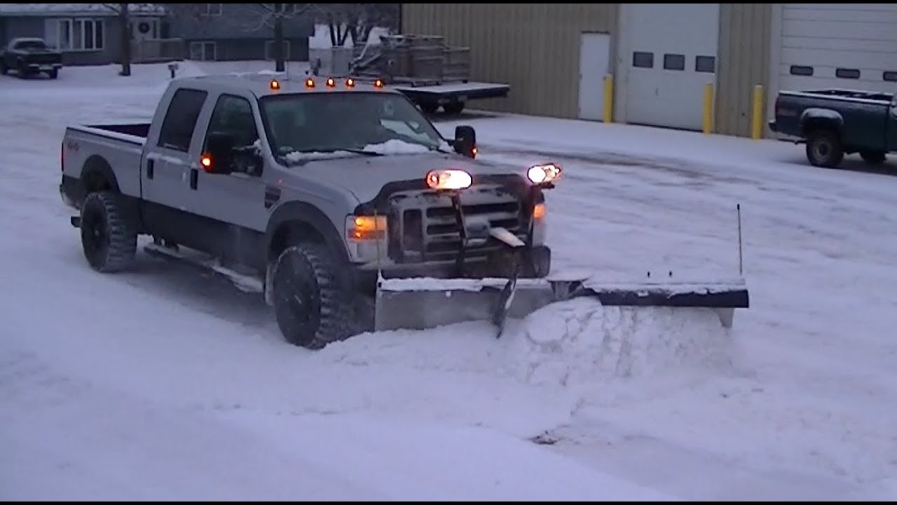 2008 Ford F250 Super Duty Plowing Snow with Snowdogg V Plow