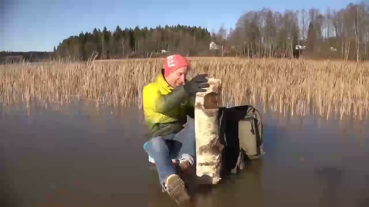Finnish man breaks ice with a log 🤣