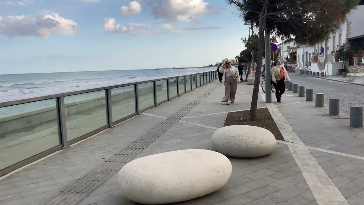 Walking on Mackenzie beach in Larnaca Cyprus on a very windy day 