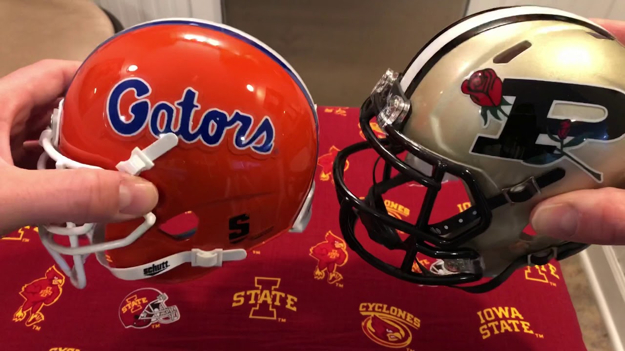 Looking at the difference between a Riddell football mini helmet and a Schutt mini football helmet.