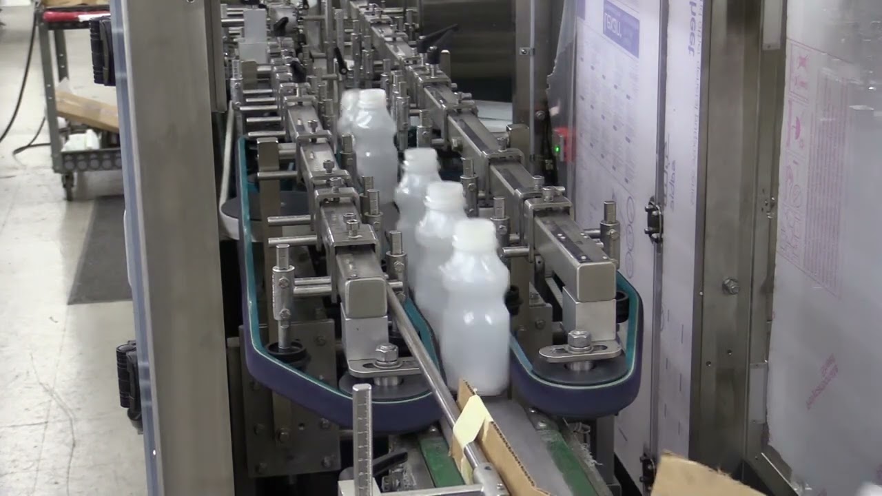 Omni-Line Model 600 Bottle Unscrambler - Unscambling Plastic Drink Bottles at 400bpm