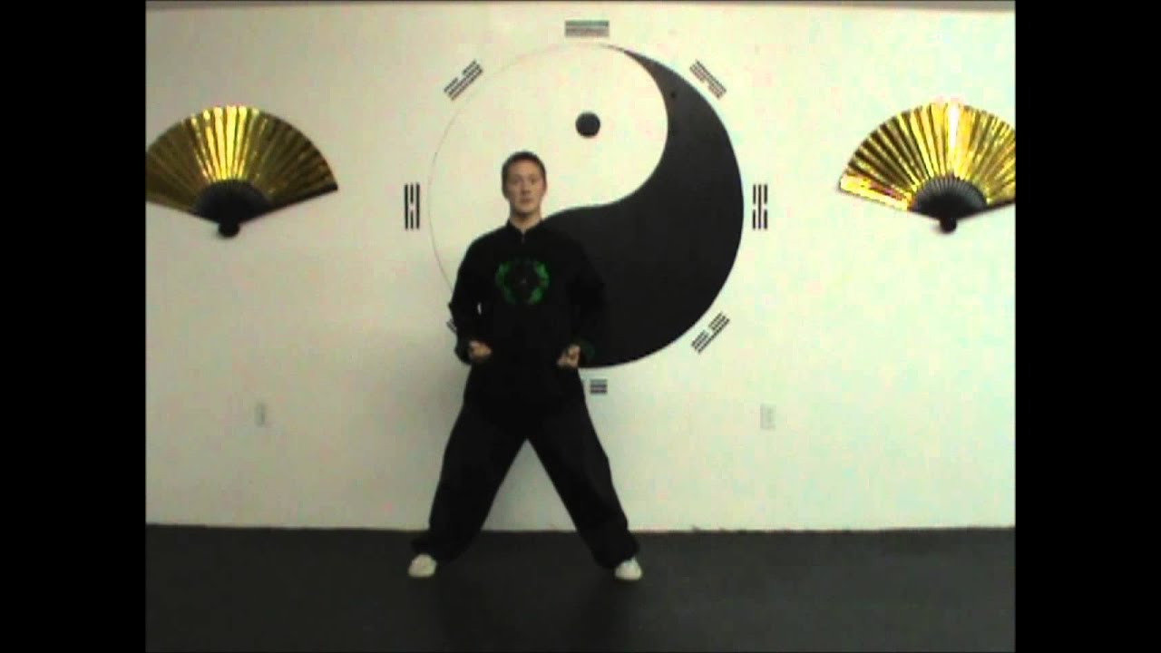 7 Clench Fists and Gaze Fiercely: 8 Pieces of Brocade Qigong Instruction