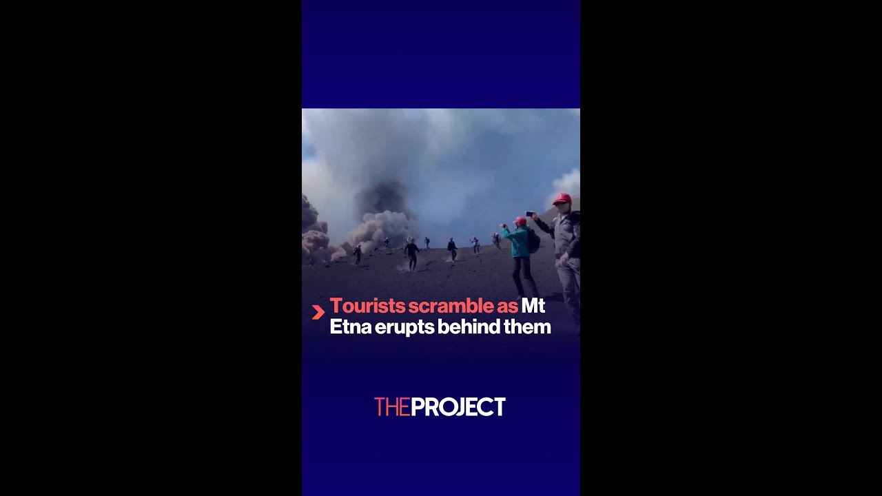 Tourists scramble as Mt Etna erupts behind them