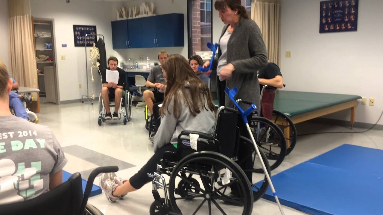 4 - Wheelchair to Stand, Stand to Wheelchair with 2 Crutches, 1 Crutch and 2 Crutches behind the whe