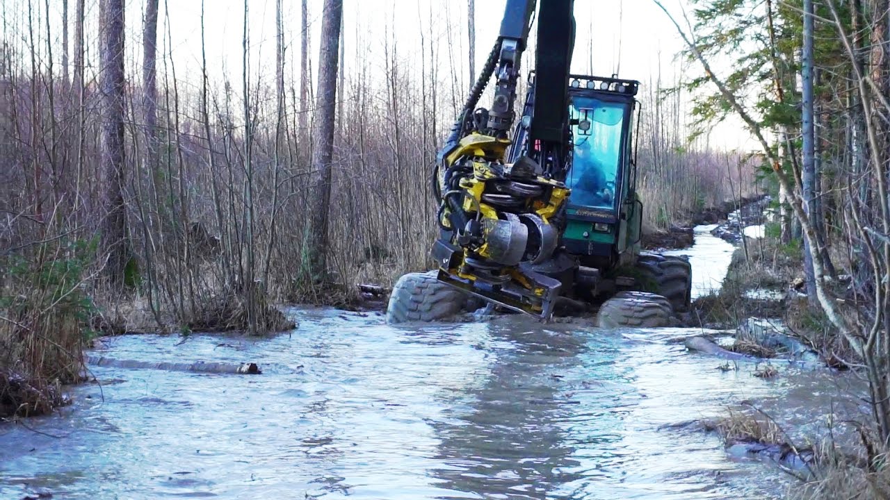 Timberjack 1270D harvester in winter forest
