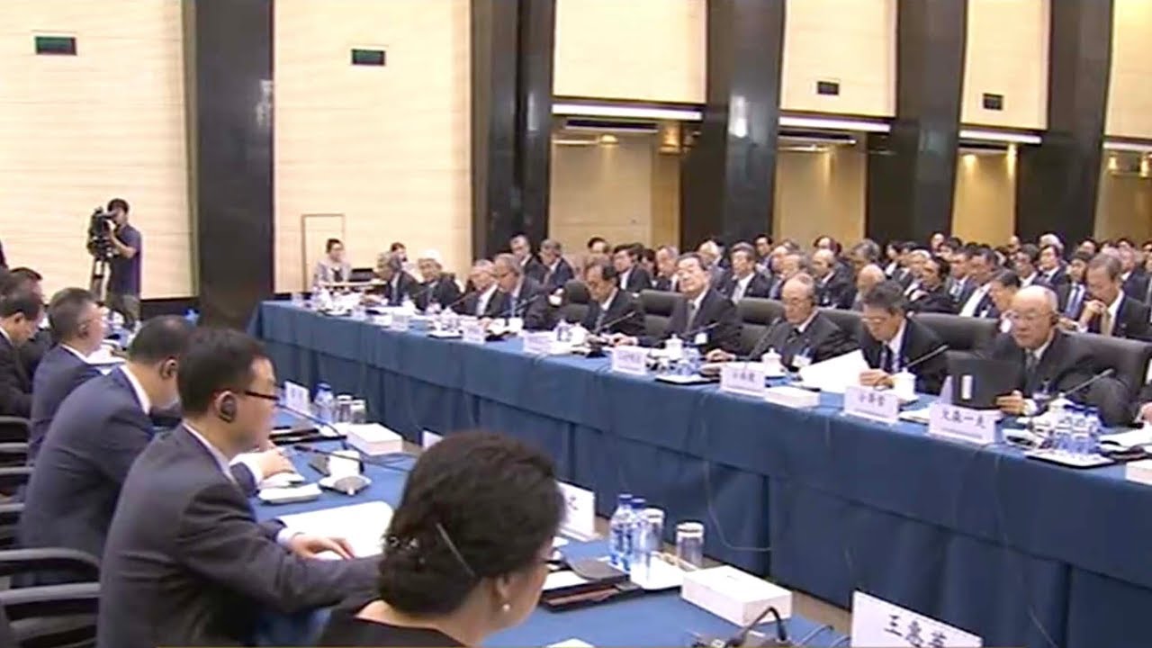 Chinese and Japanese economic officials defend free trade and open markets
