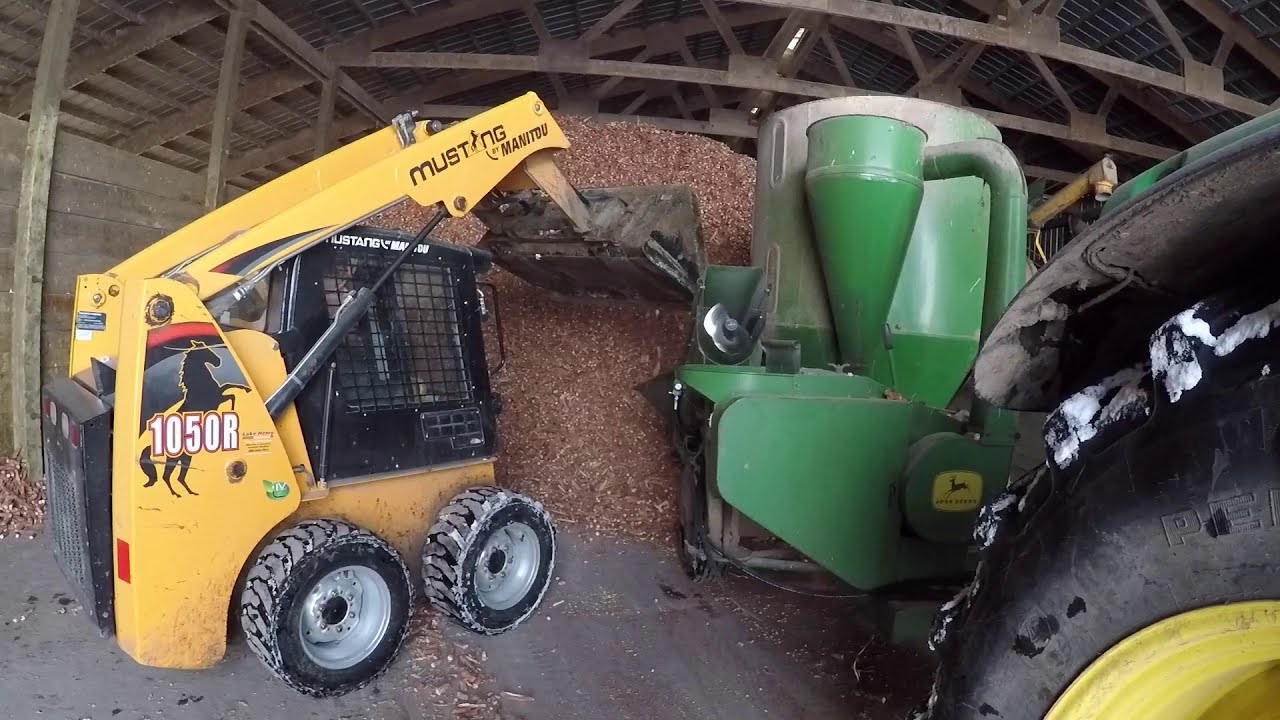 Grinding corn cobs for heat. heating the farm