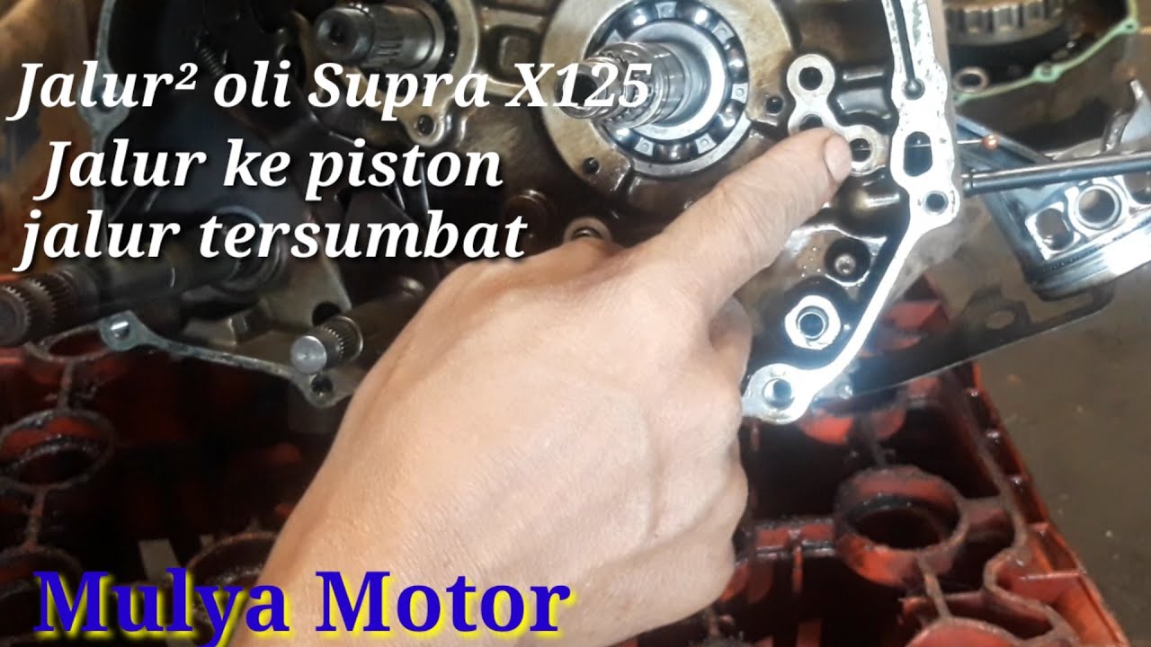 SUPRA X125,KARISMA pompa dan jalur oli ke piston.
