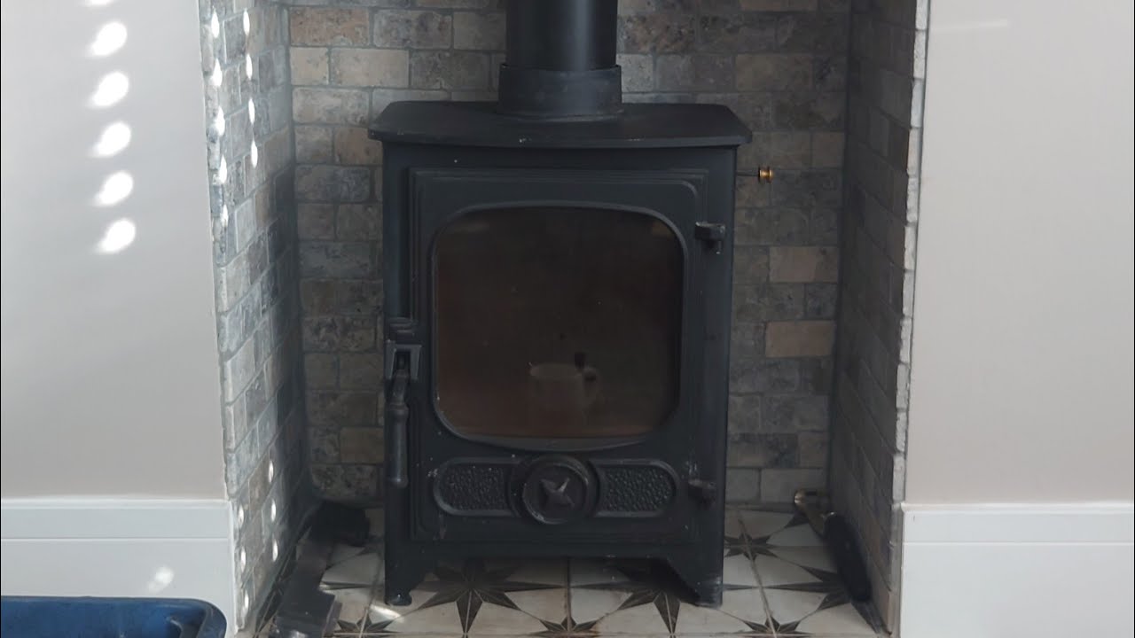 HOW TO STOP MY CHARNWOOD COUNTRY WOOD BURNER, ROCKING AND TAKEN OUT THE BAFFLE PLATE.